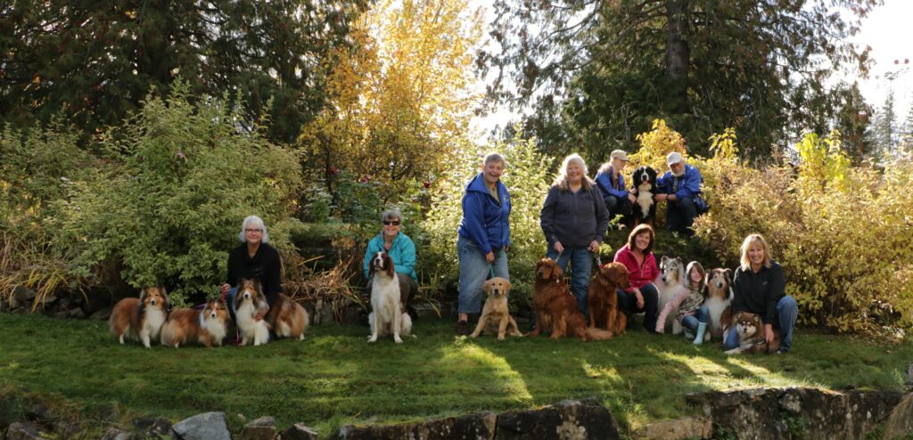 2022 group photo of WKKC members and their dogs.